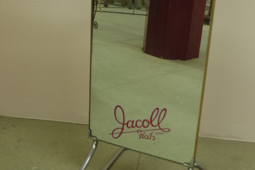 “Jacoll Hats” Mirror on Chrome Stand
