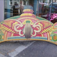 VINTAGE ROUNDING BOARD FROM A FAIRGROUND  SPEEDWAY RIDE (WINGED WHEEL )