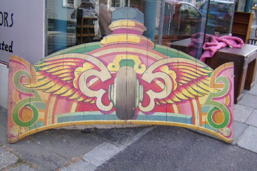 VINTAGE ROUNDING BOARD FROM A FAIRGROUND  SPEEDWAY RIDE (WINGED WHEEL )