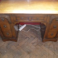CARVED OAK KNEE HOLE DESK