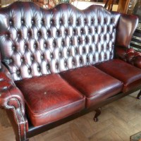 BUTTONED BACK THREE SEATER LEATHER SOFA