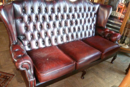 BUTTONED BACK THREE SEATER LEATHER SOFA