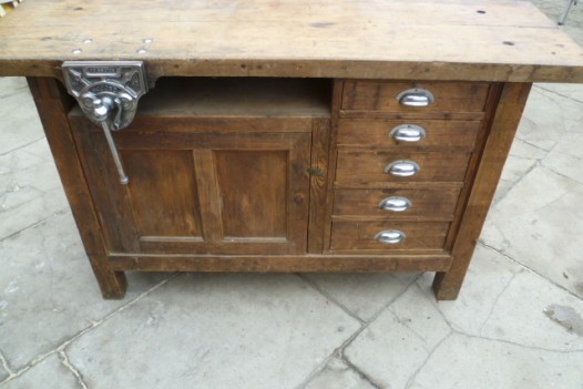 vintage workbench with polished steel vice
