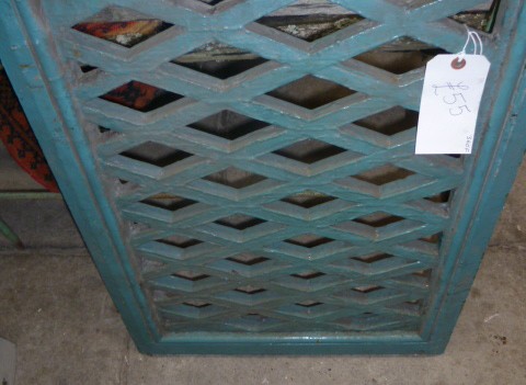 antique cast iron grille in painted hardwood frame