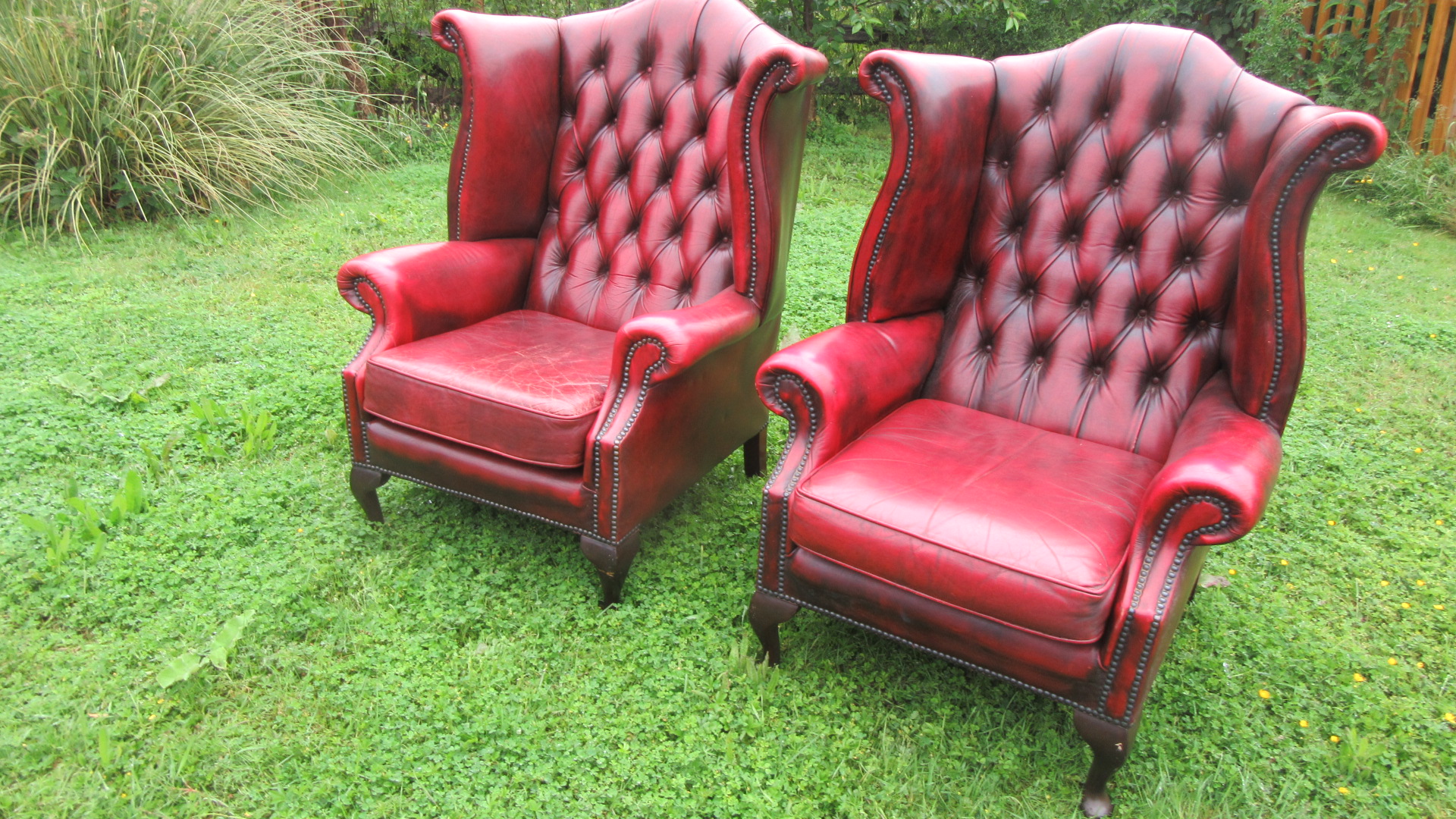 PAIR OF VINTAGE DEEP BUTTONED WING ARMCHAIRS