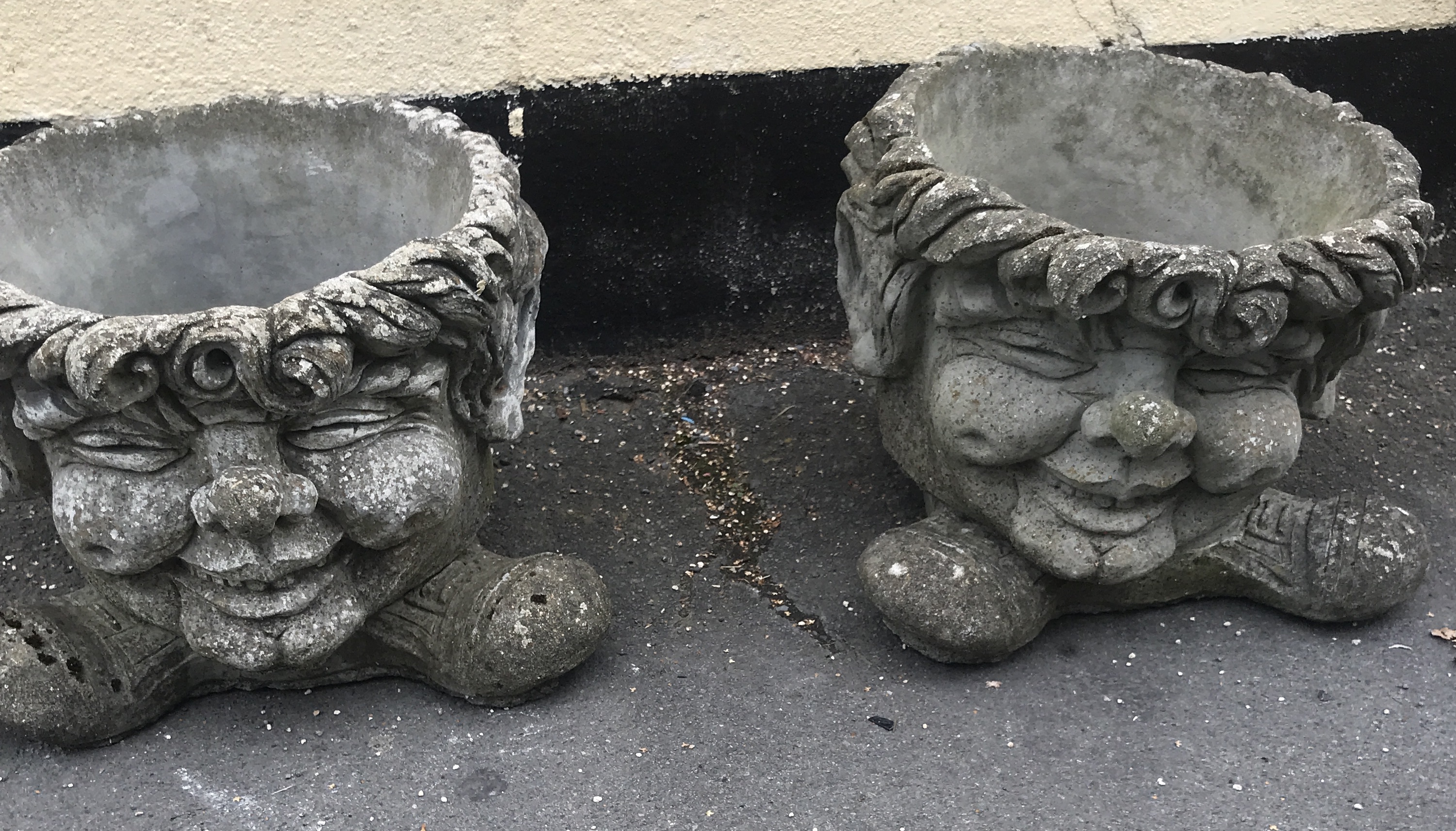 PAIR OF UNUSUAL GROTESQUE WEATHERD CONCRETE PLANTERS